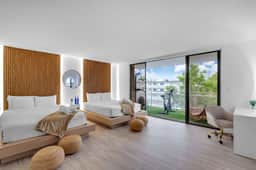 Waterfront Luxe Condo Walking Distance to Beach